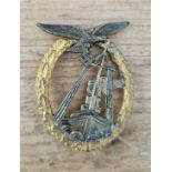 A German WWII Luftwaffe Sea Battle badge. In good condition overall, loss of gilt in places also pin