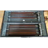 A case containing 20 violin bows, various conditions, all missing hairs.