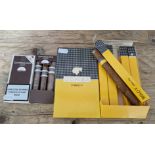 A pack of 5 Cohiba Cuban cigars together with a pack of 3 Guatanamera Cuban cigars.