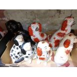A box of 19th century Staffordshire pottery dogs.