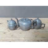 A Chinese three piece pewter tea set.