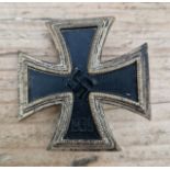 A German WWII Iron Cross, 1st class. Mark on pin, possible P747 or P197. We believe this to be