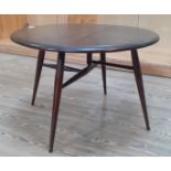 1960s Ercol dark elm drop leaf coffee table, model 308, height 40cm, width 62cm.