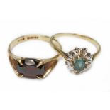 Two hallmarked 9ct gold rings, one set with a garnet and the other topaz and diamond, gross wt. 4.