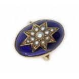 A late Georgian blue enamel and seed pearl cabochon ring, unmarked, the bezel setting measuring