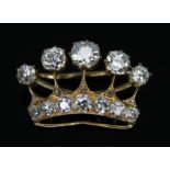 An antique diamond brooch modelled as a crown and set with twelve old cut stones weighing approx.