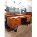 An Eon furniture teak dressing table with mirror.