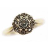 A diamond cluster ring, the round cluster measuring approx 8mm in diameter, band marked '18ct',