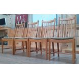 A set of four modern Ercol light elm dining chairs.