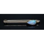 An opal set pin, the bezel set pear cabochon cut opal measuring approx. 12mm x 6.5mm, marked '