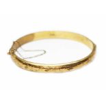 A hallmarked 9ct gold bangle, diam. approx. 5.5cm, wt. 10.8g.