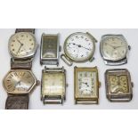A group of eight assorted vintage mechanical wristwatches including two silver, one trench type, Art