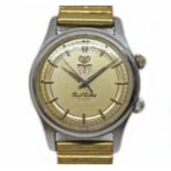 A Paul Buhre stainless alarm wristwatch, circa 1950s, case diam. 30mm, champagne dial, 17 jewel