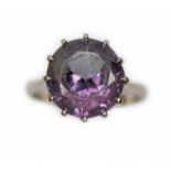 A purple synthetic sapphire ring marked '18ct', gross wt. 3.6g, size J.