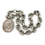 A Victorian white metal anchor link chain with photo locket, length 42cm.