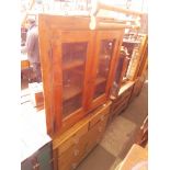 Three pieces of furniture comprising a pine chest of drawers, a pine corner cabinet and a towel