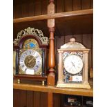 Two mantle clocks, one Japanese ceramic and one mahogany with brass dial.