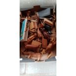 A box of treen, mainly animals.