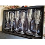 A boxed set of six Thomas Webb cut glass champagne flutes.