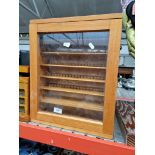 A small glazed cabinet.