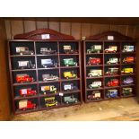 Two displays containing various die-cast model vehicles.