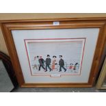 A print after L S Lowry, 'On The Promenade', 40.5cm X 30.5cm, framed and glazed, 73cm X 63cm.