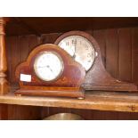 A "Napoleon" style mantel clock together with an Edwardian inlaid mantel clock.