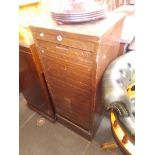 A vintage tambour front oak filing cabinet.