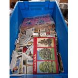 A box of cigarette cards and tea cards.