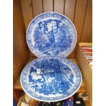 A pair of blue and white transfer-ware plates.