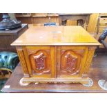 A Victorian carved oak canteen containing 'Community' pattern plated cutlery, the canteen having a