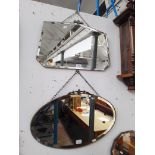 A 1930s Art Deco wall mirror together with an early 20th century oval mirror.