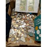 A box of world coins and banknotes.