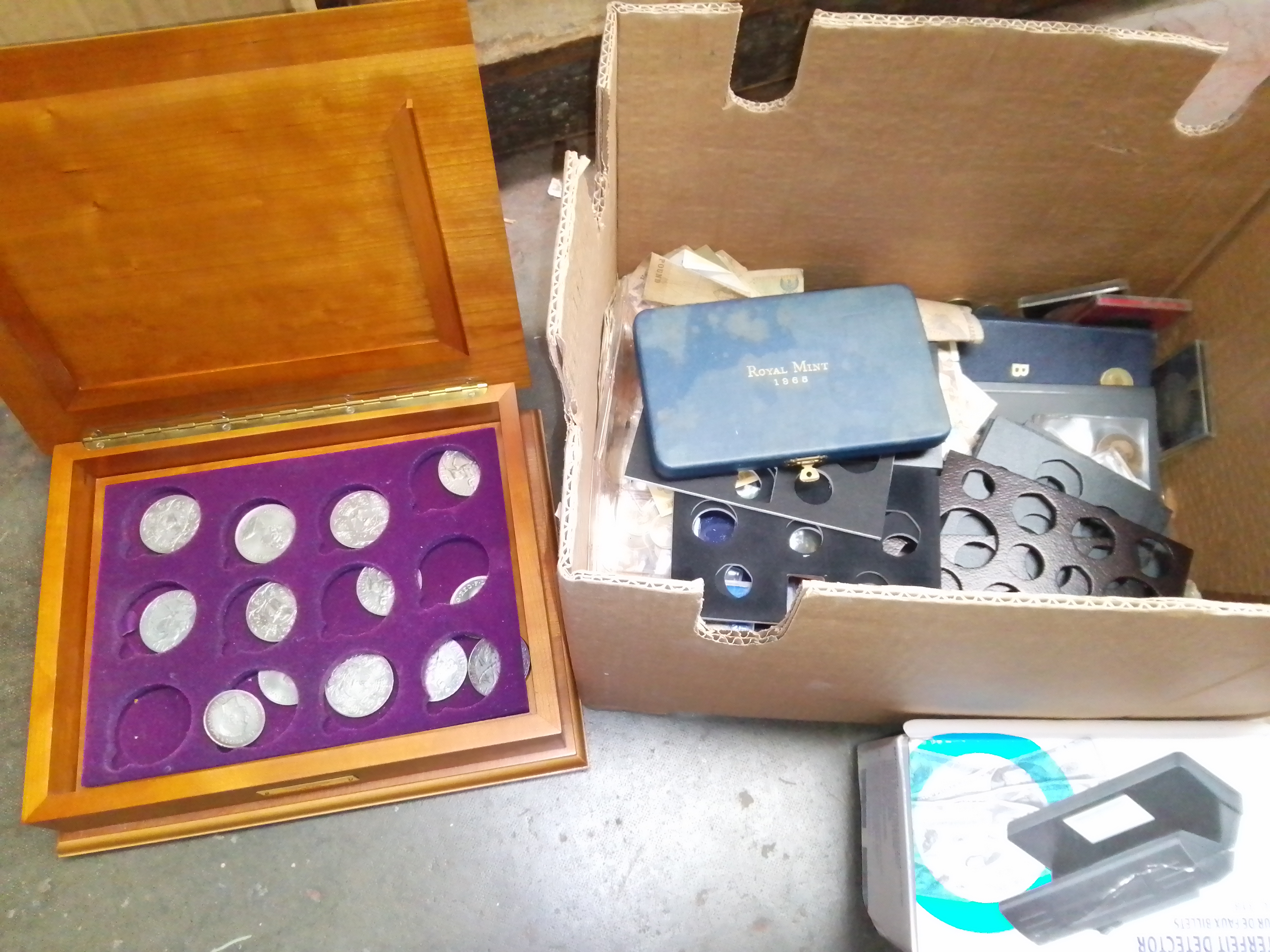 A box of world coins, banknotes and accessories