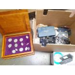 A box of world coins, banknotes and accessories