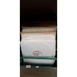 A box of assorted 12" singles and LPs.