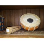 A baul drum ( AF ) and a small rain stick.