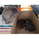 A box containing vintage horns and helmet.
