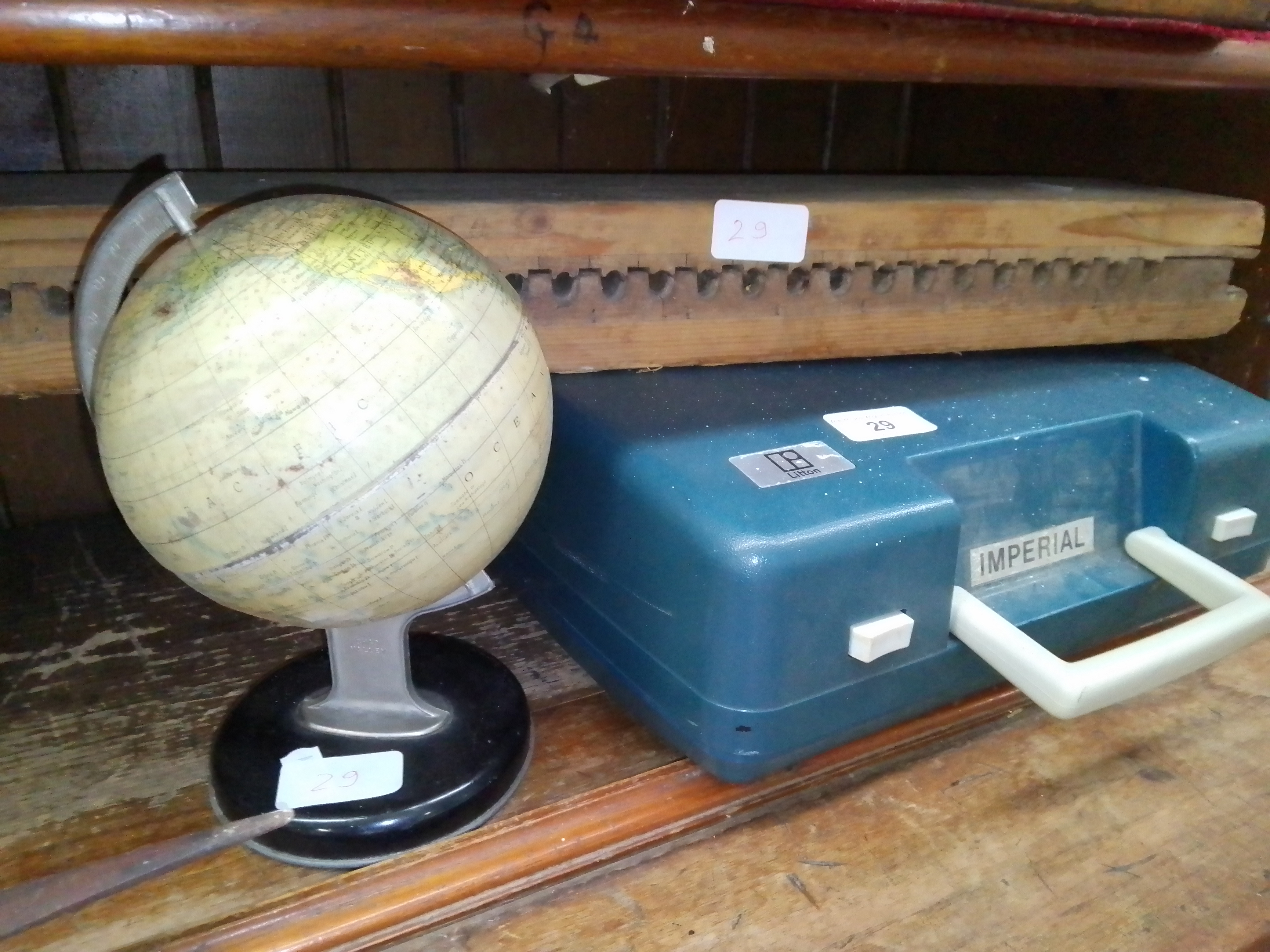 A vintage wooden German cigar press together with a vintage globe and a vintage Imperial 202