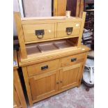 A light oak cabinet and TV stand.