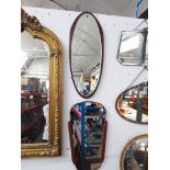 A mid 20th century Clarke Eaton floating wall mirror and another mirror of a similar age.