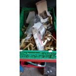 A box of metalware / hardware, mostly brass.