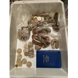 A tray of UK and world coins.