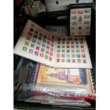 A box of various stamps, etc