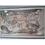 A tray of mainly silver and white metal jewellery to include chains, pendants, etc.