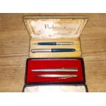 A Parker fountain pen with 14ct gold nib, a silver Longerlead pen and a set of 2 Parker pens.