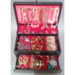 A box of assorted costume jewellery.