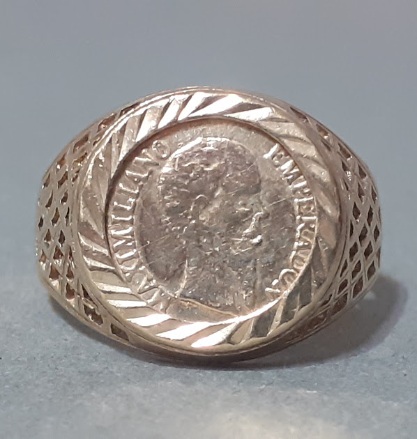 A 9ct gold signet ring set with a medallion, size L/M, gross wt. 2g.
