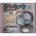 A box containing costume jewellery including silver bracelets, a watch and some teaspoons.
