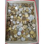 A tray of assorted world coins.